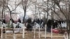 Kazakhstan - Riot police walk in center of Zhanaozen, Kazakhstan, Saturday, Dec. 17, 2011. Violent clashes broke out Friday between police and demonstrators in an oil town in western Kazakhstan. Authorities in Kazakhstan said Saturday that they have resto