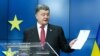 Петро Порошенко дає прес-конференцію після підписання Угоди з ЄС в Брюсселі, 27 червня 2014 року