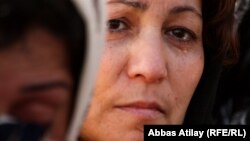 Azerbaijan -- Shiite Muslim woman mourns during a Ashura procession in Taza Pir Mosque in Baku, 2009